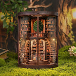 Enchanted Library DIY Book Nook Kit displayed on moss with warm interior lights