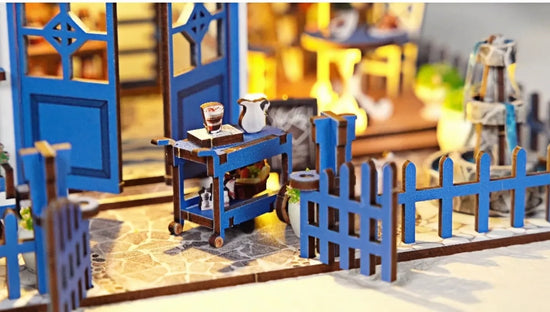 Seaside Coffee House miniature scene illuminated by warm LED lights